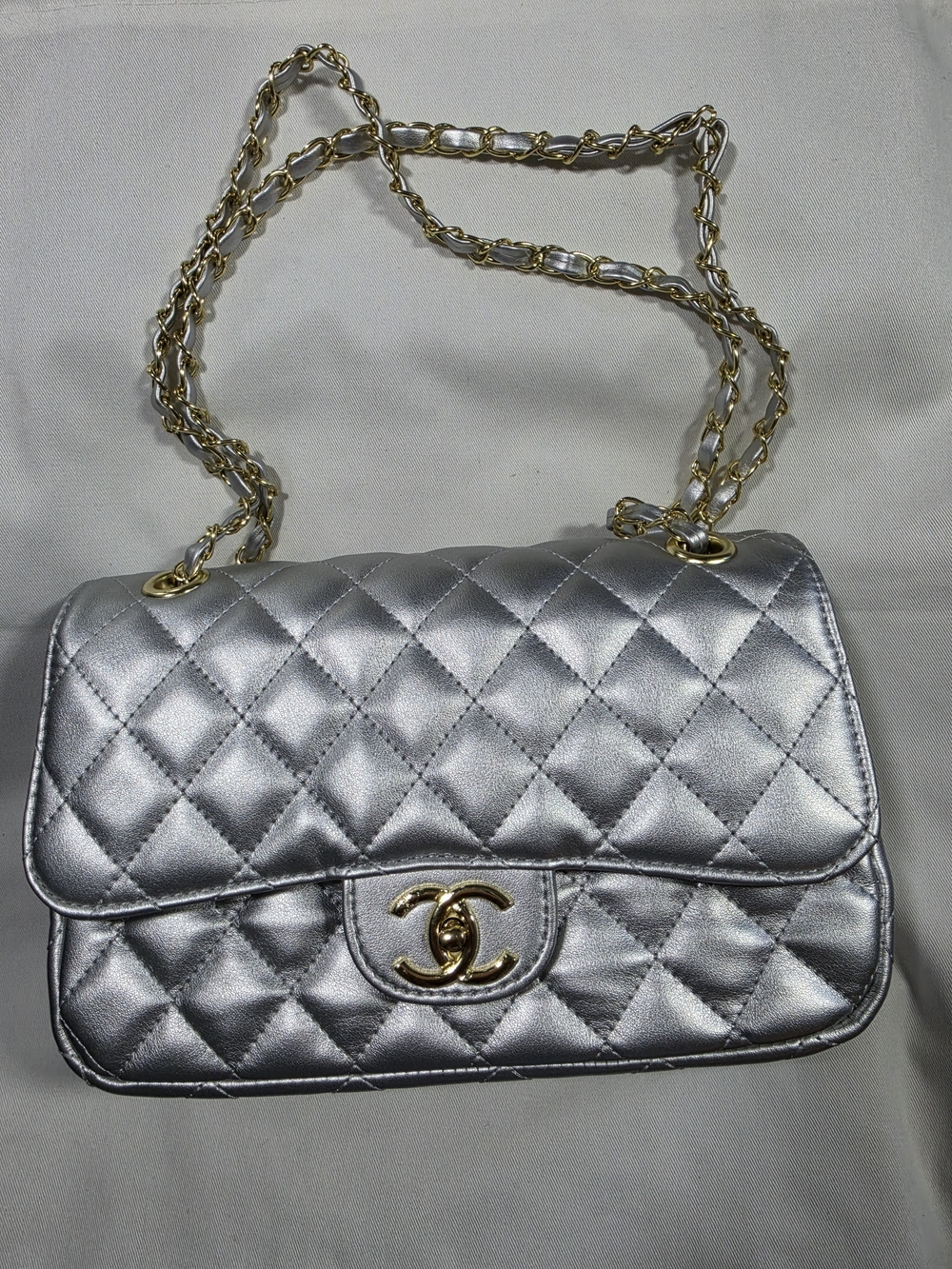 Silver Quilted Shoulder Bag with Gold Chain Strap